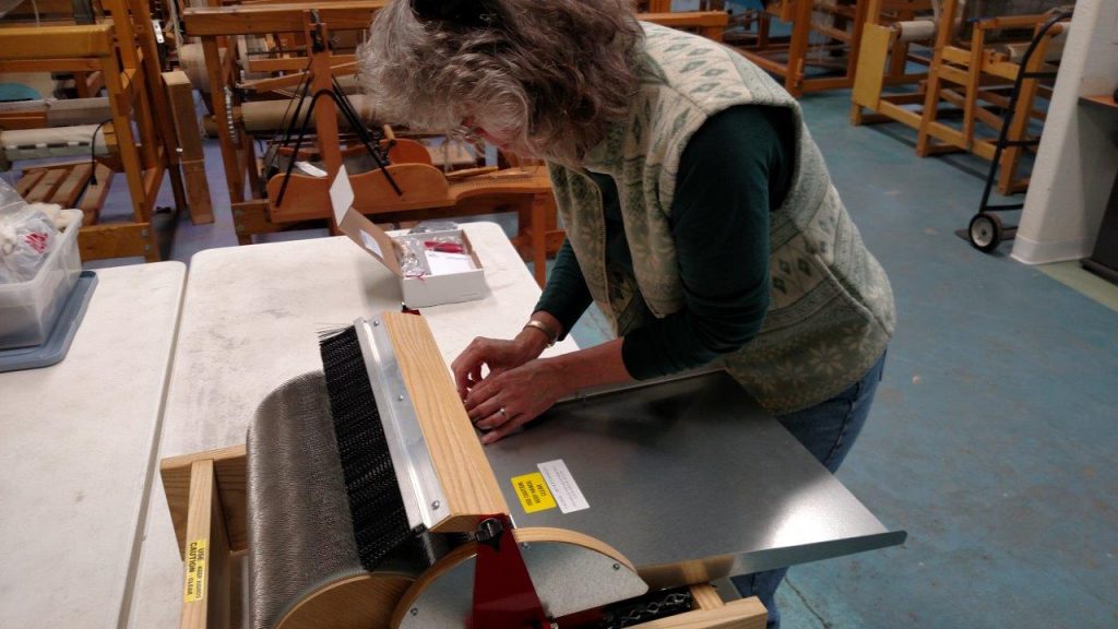 Peggy assembling a Strauch Drum Carder