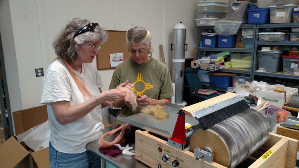 Peggy and Glenna Dean, EVFAC Patron preparing fiber for the first batt