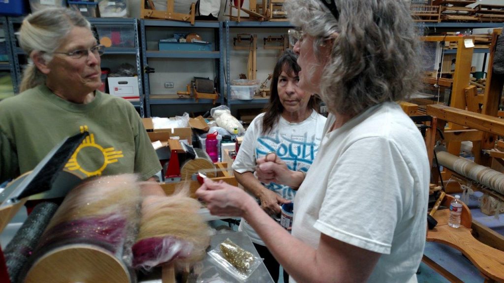 Peggy demonstrates how to remove a batt from a Strauch Drum Carder.