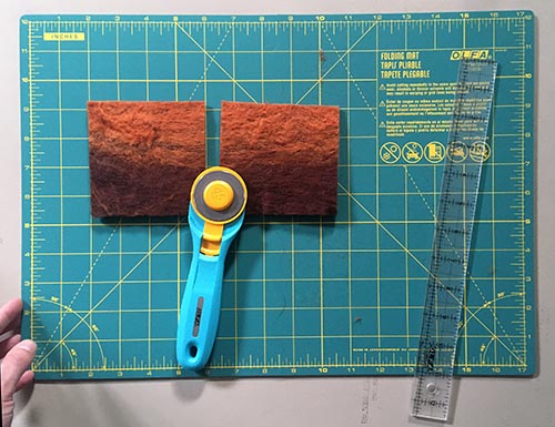 How to Wet Felt Coasters from Carded Batts - cutting squares to make felted coasters