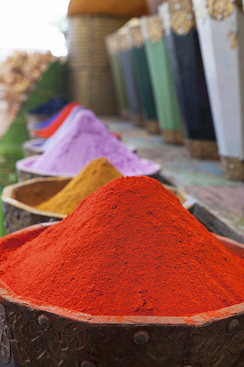 Vertical shot of natural dyes, colorful and vibrant pigment powd